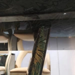 Green Veined Marble Dining Table with High-Gloss Dark Angled Pedestal and Stone Inlay Accents